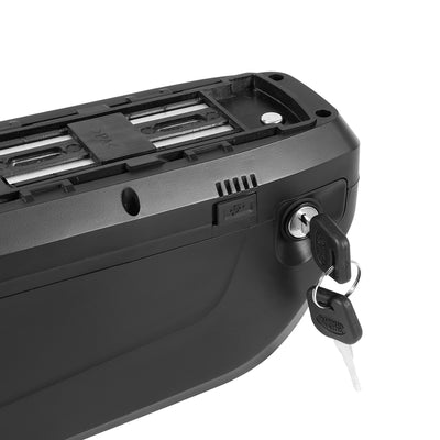Close-up of an e-bike battery with a key lock, and a USB port cover