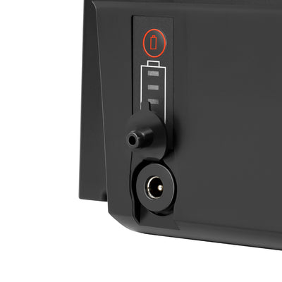 Close-up of the e-bike battery (Model EBB-048116-SF06S), featuring a battery level indicator with a red button, and a charge socket with a protective rubber cap, all on a black casing.