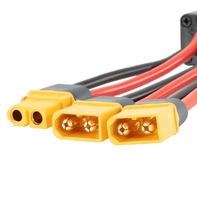 Close-up of three yellow power plugs on the MS-DBB8020 dual battery parallel module adapter
